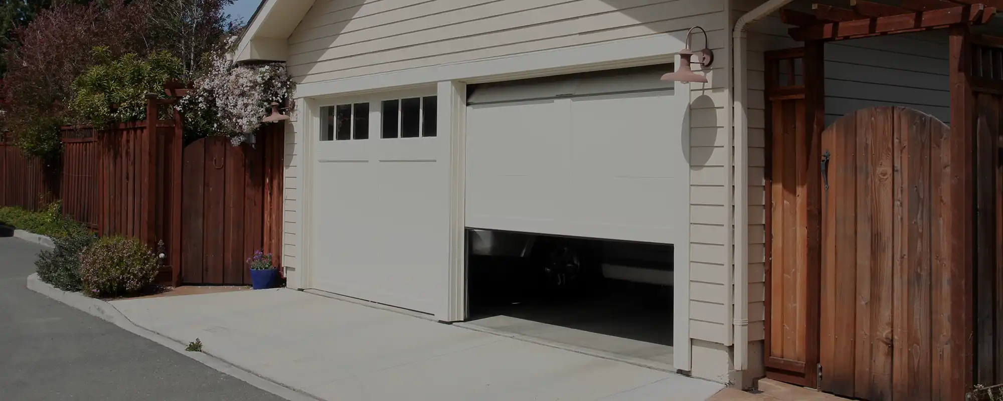 A photo of two garage doors installed by a professional garage door repair company.