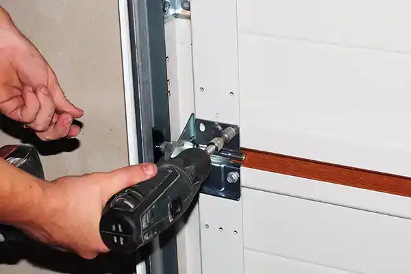 A photo of garage door maintenance being performed by a technician.