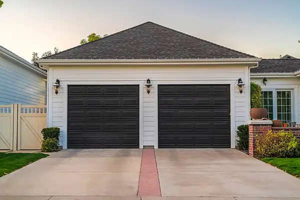 A photo of new garage doors that were just installed by a quality garage door installer.
